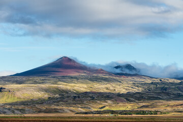 Farm by the foot of a volcano, in the vastness of Iceland