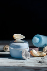 blue jar with a cosmetic product with shells and pearls