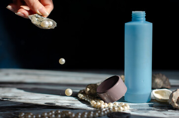 blue jar with a cosmetic product with shells and pearls