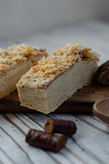 Napoleon cake on a table with sweets