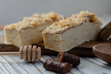 Napoleon cake on a table with sweets
