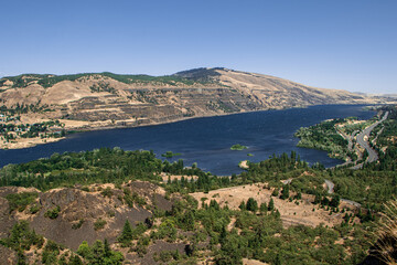 Fototapeta na wymiar Columbia River Gorge Landscape in the Pacific Northwest. Aerial View Above Rowena Crest in Oregon. Clear Blue Skies on a Warm Summer Day.