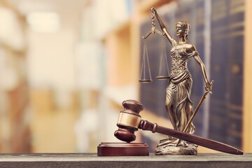 Lady Themis with scales of justice and stack books