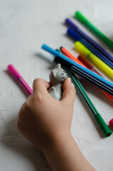 Naklejka premium children's hands with toys and felt-tip pens