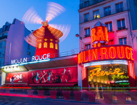 Paris, France-March 18, 2016 : The Famous Cabaret Moulin Rouge Located Close To Montmartre In The District Of Pigalle On Boulevard Clichy In The 18th Arrondissement Of Paris.