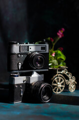 two old cameras on the table