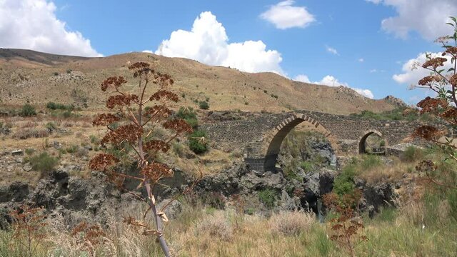 Medieval bridge of Adrano, Sicily, of arabic origin and saracen. Called Simeto river  lava gorges. Video 4k