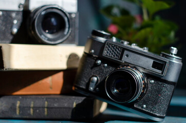 vintage camera on the table with books