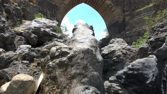 Medieval bridge of Adrano, Sicily, of arabic origin and saracen. Called Simeto river  lava gorges. Video 4k