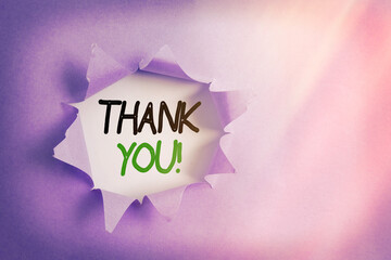 Writing note showing Thank You. Business concept for polite expression to acknowledge a gift,...