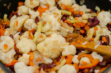 cauliflower with beans fried in a pan