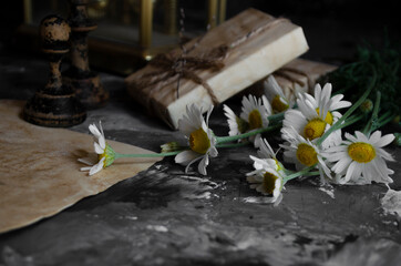 vintage clock on the table with books 
