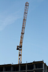 Construction crane on the construction of a building