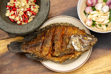 Nile Tilapia fish after fried on white plate