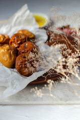 baked apples with honey on a clay plate