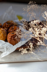 baked apples with honey on a clay plate