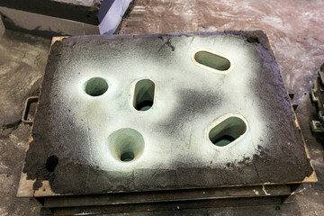 Sand molding or moulding for steel casting. The liquid hardens or sets inside the mold, adopting...