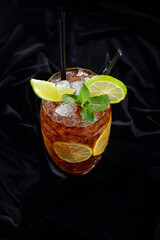 Alcoholic cocktail, Long Island ice tee, on black velvet, on a black background