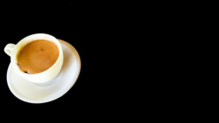 Cappucino-Milk coffee on white cup with black background. Asian morning coffee