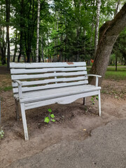 White bench in the park.