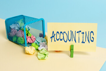 Handwriting text writing Accounting. Conceptual photo the documentation of financial transactions relating to a company Trash bin crumpled paper clothespin empty reminder office supplies tipped