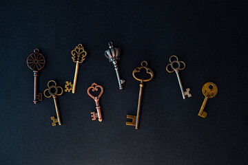 Many different old keys from different locks, scattered chaotically,