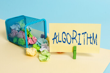 Handwriting text writing Algorithm. Conceptual photo a method or set of rules for calculations or other problem solving Trash bin crumpled paper clothespin empty reminder office supplies tipped