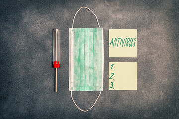 Handwriting text Antivirus. Conceptual photo suitable for the detection and removal of computer viruses Set of medical equipment with notepad for professional health condition assessment