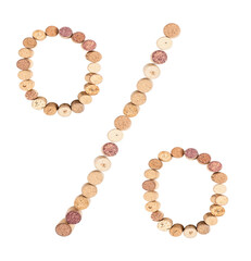 Percentage sign is made from wine corks, close-up. Isolated on white background