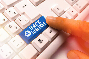 Word writing text Back To School. Business photo showcasing is the period relating to the start of a new school year White pc keyboard with empty note paper above white key copy space