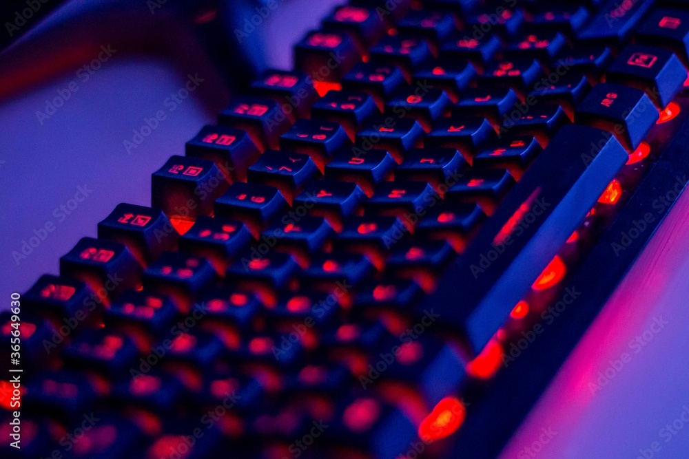 Poster closeup shot of an illuminated computer keyboard