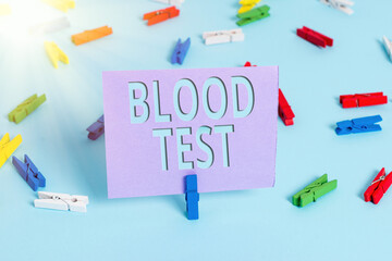 Handwriting text writing Blood Test. Conceptual photo Extracted blood sample from an organism to...