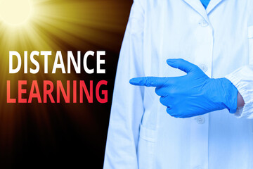 Word writing text Distance Learning. Business photo showcasing educational lectures broadcasted over the Internet remotely Displaying empty sticker paper accessories smartphone with medical gloves on