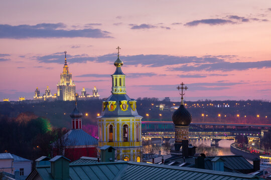 Moscow view with domes of Andreevsky convent, State University at left and 2 level bridge over Moscow river.