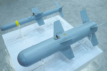 Tactical air-to-ground missiles designed for military unmanned aerial vehicles placed on a stand,...