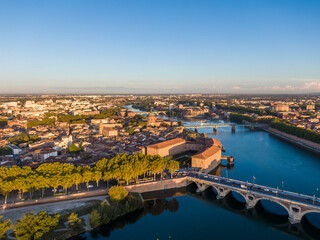 Fototapeta na wymiar Aerial view of the Toulouse city center, Saint Joseph Dome and River Garonne, France