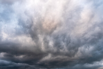 Fototapeta na wymiar storm clouds over the mountains and small birds in a dark sky, slovakia tatras