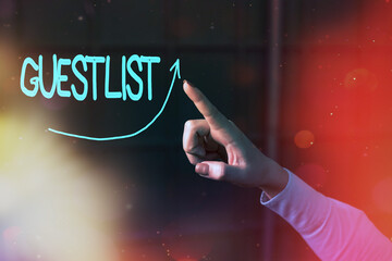 Conceptual hand writing showing Guestlist. Concept meaning list of the individuals invited to a...