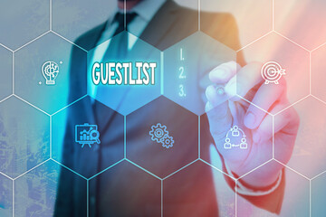 Conceptual hand writing showing Guestlist. Concept meaning list of the individuals invited to a...