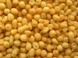 Yellow color salted fried small Boondi balls spicy Indian snack made from chickpea flour