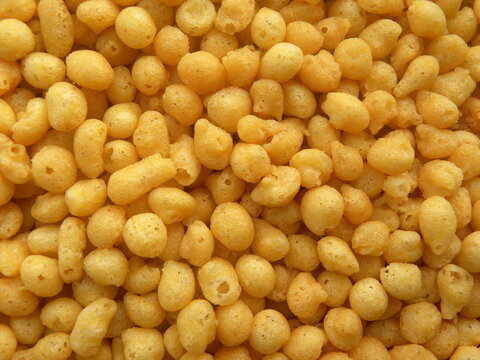 Yellow color salted fried small Boondi balls spicy Indian snack made from chickpea flour