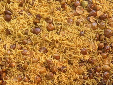 Yellow and brown color deep fried Dalmoth sev spicy Indian snack made from Masoor dal
