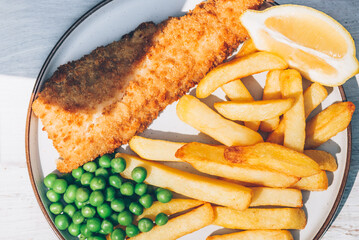 Traditional English Food such as Fish and Chips with green peas served in the Pub or Restaurant