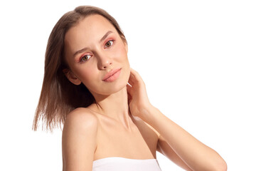 Sensual pretty woman with beautiful short brown hairs on wind, posing isolated on white. Close portrait of a girl with natural makeup.