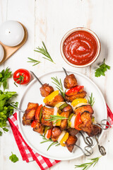 Shish kebab at skewers with vegetable.