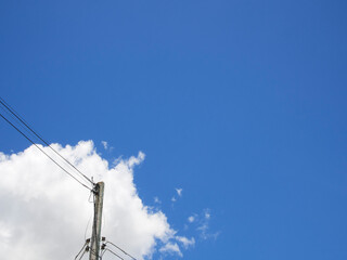 Electric pole under the blue sky