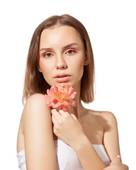 Young beautiful woman with pink flower on white isolated background. Woman with natural make up.