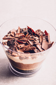 Family Pot of Irresistible Layered Billionaires Dessert made from chocolate and caramel mousse layers, chocolate brownie bites and crunchy chocolate honeycomb pieces. Finished with choco chunks