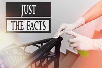 Writing note showing Just The Facts. Business concept for to have the correct information about the...