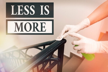 Writing note showing Less Is More. Business concept for used to express a minimalist approach is...